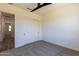 Spacious bedroom with sliding closet doors and neutral decor at 723 N Moon Rd, Apache Junction, AZ 85119
