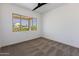 Bright bedroom with carpet flooring and large window at 723 N Moon Rd, Apache Junction, AZ 85119