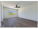 Bright bedroom with ceiling fan and large window at 723 N Moon Rd, Apache Junction, AZ 85119