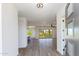 Bright and airy entryway with wood-look floors and views to the living area at 723 N Moon Rd, Apache Junction, AZ 85119
