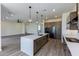 Open concept kitchen with a large island and modern appliances at 723 N Moon Rd, Apache Junction, AZ 85119