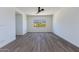 Spacious bedroom with wood-look flooring and mountain views at 723 N Moon Rd, Apache Junction, AZ 85119