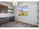 Wine room with custom cabinetry, wine cooler, and mountain views at 723 N Moon Rd, Apache Junction, AZ 85119