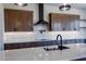 Sleek kitchen features a gas cooktop, black matte faucet, and custom cabinetry at 723 N Moon Rd, Apache Junction, AZ 85119