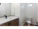 Modern bathroom with a single vanity and toilet at 723 N Moon Rd, Apache Junction, AZ 85119
