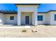 Front entry with modern door and pergola accents at 723 N Moon Rd, Apache Junction, AZ 85119