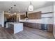 Modern kitchen with island, stainless steel appliances, and ample cabinetry at 723 N Moon Rd, Apache Junction, AZ 85119