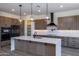 Modern kitchen with island, stainless steel appliances, and ample cabinetry at 723 N Moon Rd, Apache Junction, AZ 85119
