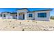 Modern home exterior with stone accents and desert landscaping at 723 N Moon Rd, Apache Junction, AZ 85119