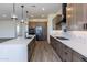 Modern kitchen with stainless steel appliances and custom wood cabinets at 723 N Moon Rd, Apache Junction, AZ 85119