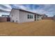 Large backyard with desert landscaping and covered patio at 17448 W Carlisle Dr, Surprise, AZ 85388