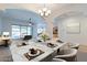 Elegant dining room with marble table and chandelier at 18449 W Piedmont Rd, Goodyear, AZ 85338