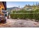 Stone patio with lush greenery and mountain views at 11070 E Rolling Rock Dr, Scottsdale, AZ 85262