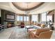 Spacious living room with fireplace and panoramic mountain views at 11070 E Rolling Rock Dr, Scottsdale, AZ 85262