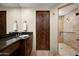 Bathroom with granite countertop, double sinks, and large shower at 11070 E Rolling Rock Dr, Scottsdale, AZ 85262