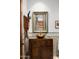 Upscale bathroom with unique vanity, vessel sink, and decorative mirror at 11070 E Rolling Rock Dr, Scottsdale, AZ 85262