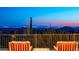 Panoramic city views from a balcony with chairs at 11070 E Rolling Rock Dr, Scottsdale, AZ 85262