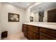 Vanity with wood cabinets and a large mirror at 11070 E Rolling Rock Dr, Scottsdale, AZ 85262
