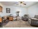 Home office with two comfy armchairs, a desk, and a printer at 8351 E Monte Ave, Mesa, AZ 85209