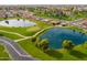 Community overview featuring two serene ponds and a golf course at 8351 E Monte Ave, Mesa, AZ 85209