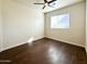 Bedroom with wood-like flooring and ample natural light from the window at 4030 N Palm Cir, Eloy, AZ 85131