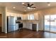 Modern kitchen featuring stainless steel appliances, white cabinets, and wood-like flooring at 4030 N Palm Cir, Eloy, AZ 85131