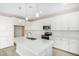 Modern kitchen features white cabinets, quartz countertops, and stainless steel appliances at 18741 E Elizar Dr, Gold Canyon, AZ 85118