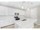 Modern kitchen featuring white cabinets, quartz countertops, and stainless steel appliances at 18741 E Elizar Dr, Gold Canyon, AZ 85118