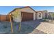 New home with a two-car garage and landscaping at 18741 E Elizar Dr, Gold Canyon, AZ 85118