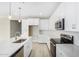 Modern kitchen with white cabinets, quartz countertops and stainless steel appliances at 18741 E Elizar Dr, Gold Canyon, AZ 85118