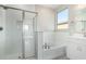 Bright bathroom with white subway tile, soaking tub, and walk-in shower at 18741 E Elizar Dr, Gold Canyon, AZ 85118