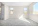 Bright bedroom featuring grey carpet and large windows at 18741 E Elizar Dr, Gold Canyon, AZ 85118