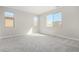 Spacious bedroom with grey carpet and multiple windows at 18741 E Elizar Dr, Gold Canyon, AZ 85118
