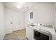 Laundry room with washer, dryer, and ample storage at 39012 N 8Th St, Phoenix, AZ 85086