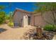 House exterior showcasing a two-car garage and a well-manicured front yard at 39012 N 8Th St, Phoenix, AZ 85086