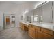 Double vanity bathroom with large mirror and shower at 39012 N 8Th St, Phoenix, AZ 85086