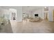 Open living room with tile and wood flooring, high ceilings, and views to kitchen and dining areas at 39012 N 8Th St, Phoenix, AZ 85086