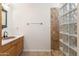 Bathroom with wood vanity and glass block shower at 39012 N 8Th St, Phoenix, AZ 85086