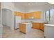 Kitchen with light wood cabinets, island, and tile flooring at 39012 N 8Th St, Phoenix, AZ 85086