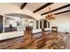 Elegant dining room with hardwood floors, chandelier, and exposed beams at 6310 E Dove Valley Rd, Cave Creek, AZ 85331