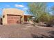 Charming home with a rustic garage and desert landscaping at 6310 E Dove Valley Rd, Cave Creek, AZ 85331