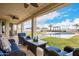 Spacious covered patio with comfortable seating and pool view at 13621 W Tuckey Ct, Glendale, AZ 85307