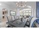 Formal dining room showcasing a large table and chandelier at 13621 W Tuckey Ct, Glendale, AZ 85307