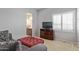 Relaxing sitting area with a sofa and ottoman at 13621 W Tuckey Ct, Glendale, AZ 85307