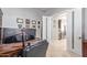 Bright home office with a large desk and access to kitchen at 13621 W Tuckey Ct, Glendale, AZ 85307