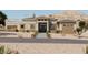 Modern home exterior with stone accents and desert landscaping at 21434 W Mountain Cove Pl, Buckeye, AZ 85396