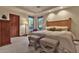 Spacious bedroom with a king-size bed and wooden headboard at 11440 E Black Rock Rd, Scottsdale, AZ 85255