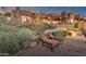 Relaxing patio with lounge chairs, offering a tranquil view of the home at 11440 E Black Rock Rd, Scottsdale, AZ 85255