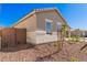 Side view of a house with desert landscaping at 24041 N 171St Ln, Surprise, AZ 85387
