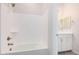 Clean bathroom with a shower/tub combo and white vanity at 24041 N 171St Ln, Surprise, AZ 85387